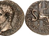 a silver coin with an image of a man on it