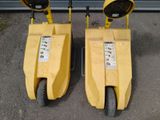 two yellow traffic lights sitting on top of each other