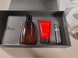 a bottle of perfume and a tube of lotion in a box