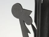 sculpture of a man holding a knife and fork in his right hand