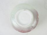 a white plate with a red and white design on it