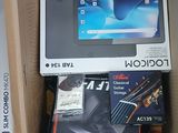 a lot of electronic items in a box on the floor