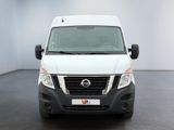 the front of a white van is parked in a white room