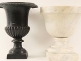 two vases sitting next to each other on a table