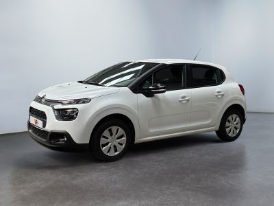 a white citrole car parked in a white room