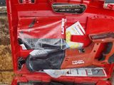 a red tool case with tools in it on the ground
