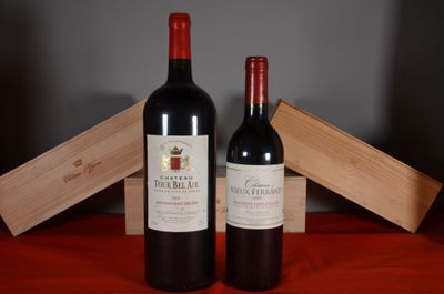 two bottles of wine sitting next to each other on a table