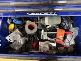 a blue box filled with assorted electronics and wires