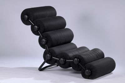 an image of a black leather lounge chair and ottoman on a white background