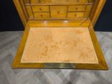 a wooden chest of drawers with a mirror on top of it