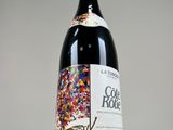 a bottle of wine that has sprinkles on it