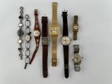 several different types of watches are displayed on a white surface