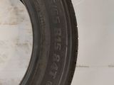 a close up of a tire on a wall with a white background