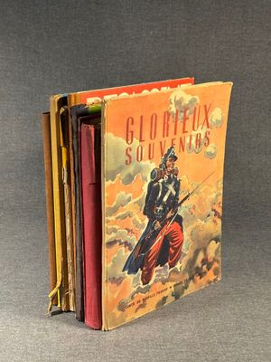 three books are stacked on top of each other on a table