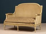an image of a chair with a striped upholstered back