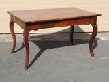 a small table that is sitting on the pavement