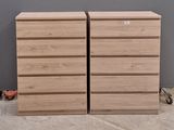two wooden drawers sitting next to each other on the floor