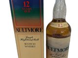 an image of a bottle of whisky next to a box