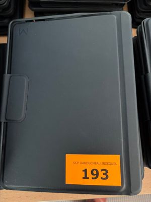 a lot of black boxes with orange tags on them