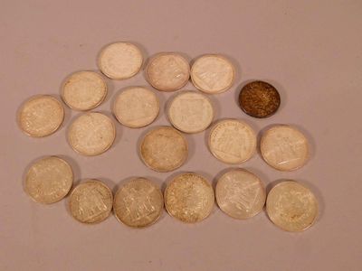 a small amount of coins on a table next to a penny