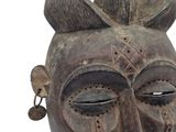 an image of a close up of a wooden mask on a white background
