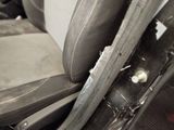 an image of a car seat with a broken arm rest