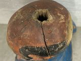 a blue fire hydrant that has a hole in it