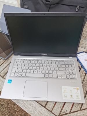 a laptop that is sitting on a table with a bag