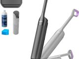 a close up of a cordless vacuum cleaner with a cleaning kit