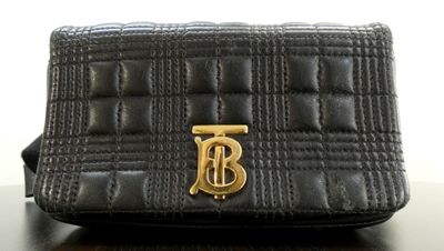 an image of a black purse with a gold b on it
