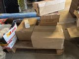 a pile of cardboard boxes sitting on a pallet