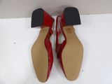 pair of red shoes with black heel and red heel