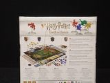 the harry potter board game is in its box on a black surface