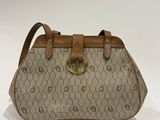 a beige and brown handbag with a brown handle
