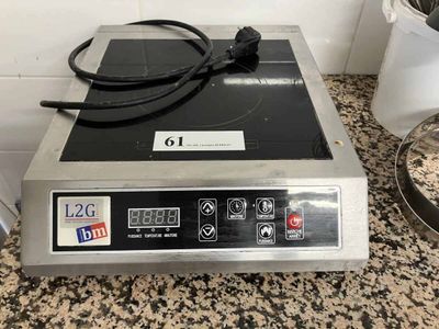 an image of a stove top on a granite counter top