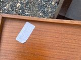 a piece of furniture that has been left on the ground