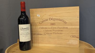 a bottle of wine sitting on a wooden table