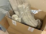 a cardboard box filled with socks and socks on the floor