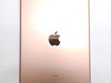 an apple ipad is shown on a white surface with a light shining on it