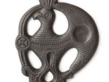 an image of a metal object with a bird on it