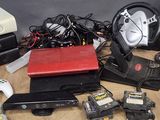 a lot of electronics and games on the table