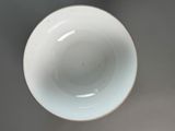 a white bowl sitting on top of a table