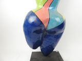 sculpture of a woman ' s torso on a black base