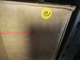 a brown paper bag with a yellow sticker on it