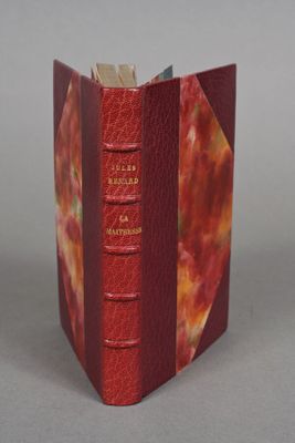 a red book that is open on a table
