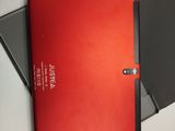 two red notebooks sitting next to each other on a table