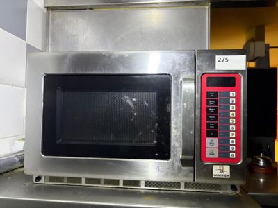a microwave that is sitting on a counter in a kitchen