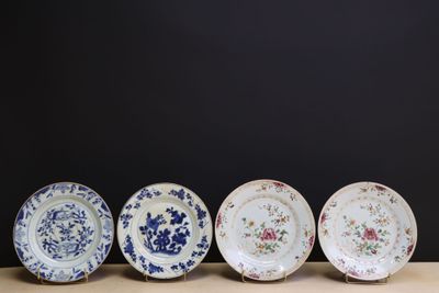 four plates are lined up in a row on a table