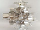 an image of a metal sculpture of a sailboat on a white surface