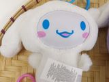 two stuffed animals sitting in a basket on a table